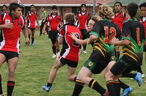 Endeavour winger Andrew Montgomery scrambles back in defence after taking a high bomb 