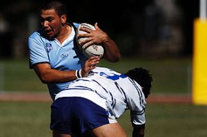 Matthew Mundine (NSWCHS) is tackled by Greg Waddell (NSWCCC)