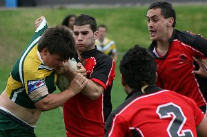 Endeavours' defence tries to push the Hunter player into touch 