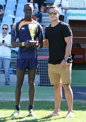 Chase Stanley proudly presents the Chase Stanley Cup to the Westfields SHS u15 Captain (Photo : steve monty / OurFootyMedia)