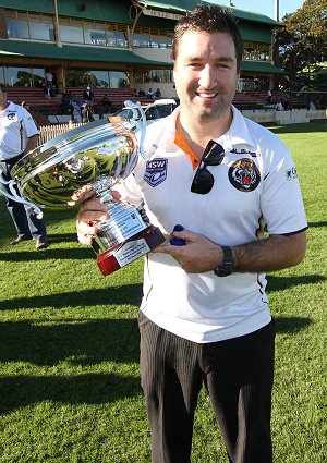 Matthew HEAD Balmain Tigers coach proudly hold the National u18s Club Championship Cup (Photo : OurFootyMedia) 