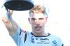 Curtis Scott holds up the 2015 SG Ball Cup Cronulla Juniors in Action