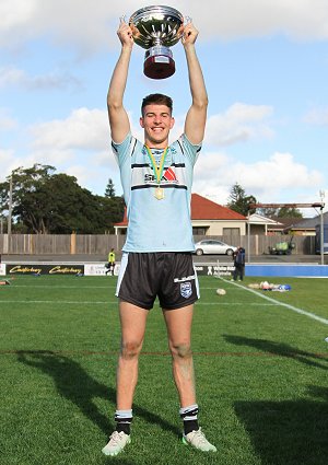 Cronulla Sharks U18 Captain Curtis Scott hold up the National Club 18 Cup (Photo : steve montgomery / OurFootyTeam.com)