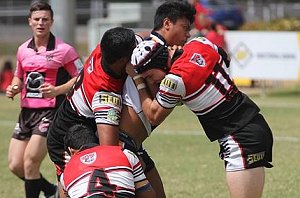 Kirwan State High School defenders swarm over a Westfields Sports High player during yest gio schoolboy cup qtr finals 