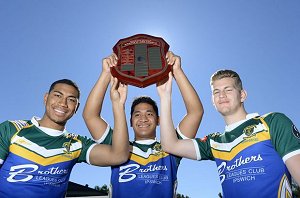 St Peter Claver College first grade players Paolo Aokuso, Junior Tafito and Luke Rose celebrate winning the Gee Shield.