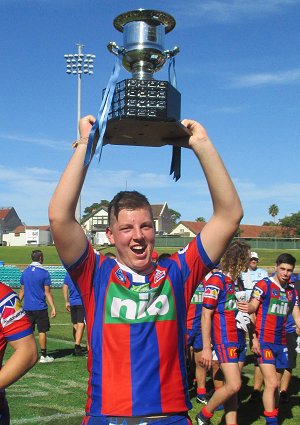 Knights Ccaptain Jaron Percell is stoked to hold up the NSWRL Harold Matthews Cup(Photo : steve montgomery / OurFootyTeam.com)