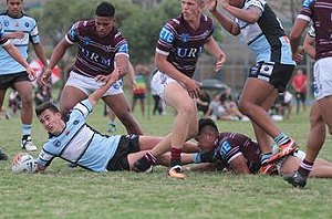 Damon Smith smashes thru for a great try v Manly (Photo : Steve Montgomery / OurFootyTeam.com) 