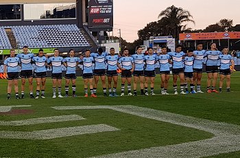 Cronulla Sharks line up in honour of John Chalk ( Photo : Steve Montgomery / OurFootyTeam.com)