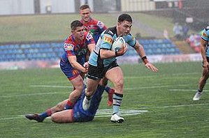 Cronulla 2nd Rower Tom Caughlan about to smash his way over for a great try in the wet - NSWRL Jersey Flegg Cup Rnd 24 Canterbury-Newcastle Knights v Cronulla-Sutherland Sharks Action (Photo's : Steve Montgomery / OurFootyTeam.com)