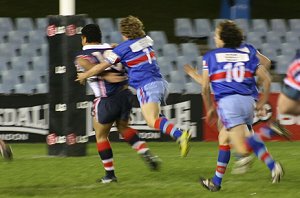 Cheeza tries to grab a ride on the big Rooster - Engadine Vs Menai at Shark Park (Photo's : ourfooty media)