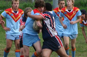 Brett Speers gets wrapped up - Menai Roosters Vs De la Salle U 15A's (Photo : ourfooty media)