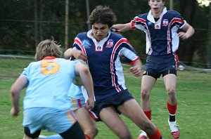Monty lines up the Rooster attacker then smashes his over the sideline - Menai Roosters Vs De la Salle U 15A's (Photo : ourfooty media)