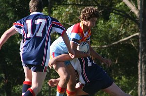 Gene DuBois get smashed - U15A's Roosters Vs De La Salle (Photo : ourfooty media)