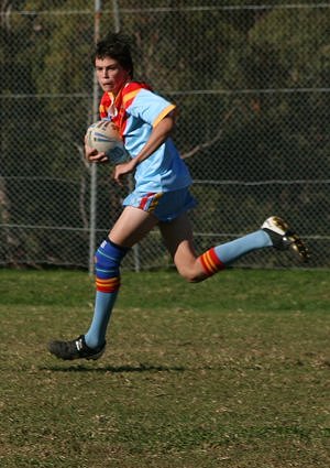 Jackson Clark runs into the clear - U15A's Roosters Vs De La Salle (Photo : ourfooty media)
