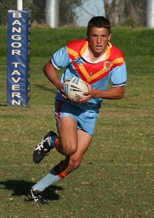 Dion Beattie runs straight at the Roosters line - U15A's Roosters Vs De La Salle (Photo : ourfooty media)