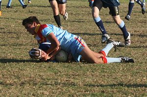 Dion Beattie creams the Colts defender - De la Salle Vs Aquinas Colts Rnd 9 (Photo : ourfooty media)