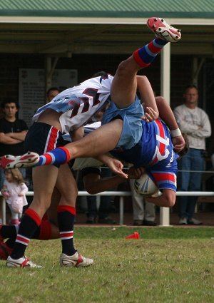 Dragons Skipper Mick Morris is dumped in a fine tackle Menai Roosters & Engadine Dragons Under 16A's (photo : ourfooty media)