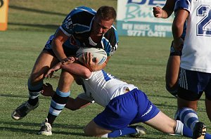 Sam Baraket gets tackled by the defender - Bulldogs vs Sharks Matty's Cup trial game 