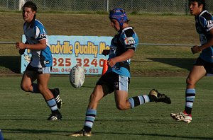 Harrison Day kicks the ball clear for the Sharks in the Bulldogs vs Sharks Matty's Cup trial game