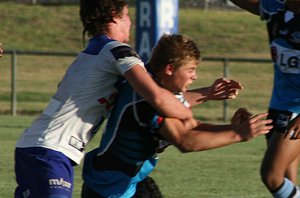 Reece Davidson unloads despite of the attention of the defenders in the Bulldogs vs Sharks Matty's Cup trial game