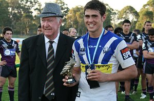 Dale Finucane accepts his 'GOLDEN BOOT - Best Player of the Year' award from Mr. John Riodan VP at Souths Juniors (Photo's : ourfooty media) 