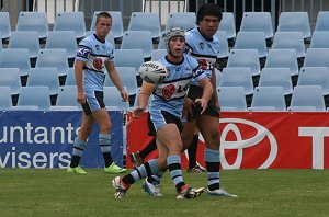 Dane Malone whips out a pass - Sharks vs Tigers SG Ball Round 1 (Photo's : Steve Montgomery / OurFootyTeam.com) 