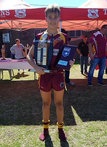 Chevy Stewart proudly holds the Cronulla Junior League Under 14's gold Premiership Trophy (Photo : Steve Montgomery / OurFootyTeam.com)