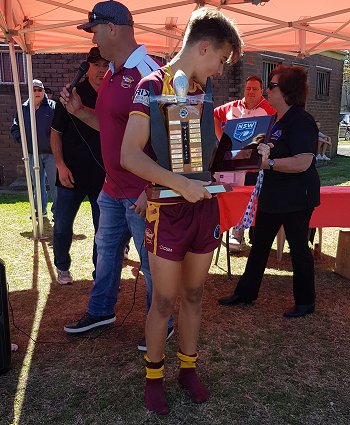 Chevy Stewart proudly holds the Cronulla Junior League Under 14's gold Premiership Trophy (Photo : Steve Montgomery / OurFootyTeam.com)