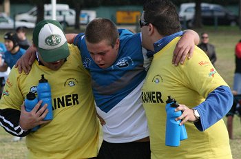 Cronulla-Caringbahs' Tom Fry gets helped off the field ( Photo : ourfooty media)