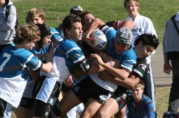 De La Salles' Dion Beattie get tackled ( Photo : ourfooty media)
