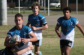 Micheal clears the ball for the Sharks 
