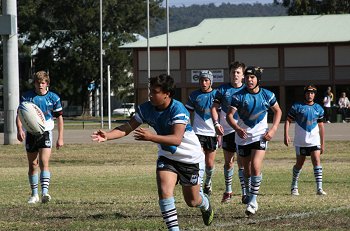 Micheal clears the ball for the Sharks 
