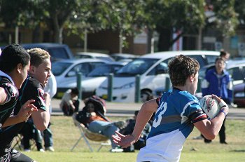 Micheal clears the ball for the Sharks 