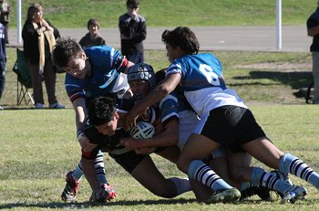 Micheal clears the ball for the Sharks 