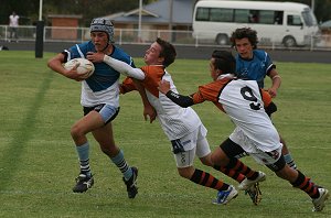 Dion Beattie pushes past a tackle 