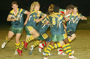 Rabbit hunt: Cairns players Nick Hanigan, Robbie Kyles and Trevor Port round up South Sydney centre Jack Leehang. Picture: NORBERT von der HEIDT