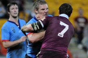 Dominic Walsh charges into the Queensland half back (Photo : Matt Roberts / QRL)