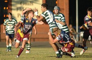 James Pomfret is met by two Wellington defenders