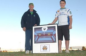 Kenny Bruce with raffle winner Joel Crowe and the framed Australian guernsey.