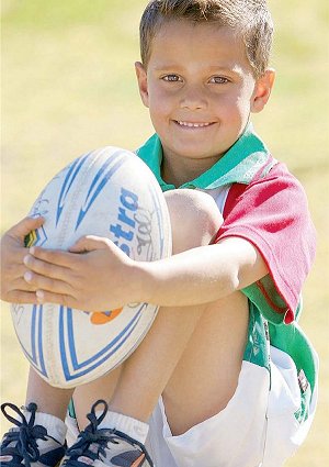 Jayden McLachlan, 6, and his favourite football at Craig Field’s Wagga home yesterday.