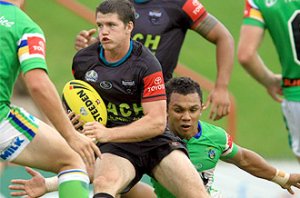 Lachlan Coote takes on the Raiders in the Toyota Cup. Photograph. Mark Evans / The Daily Telegraph