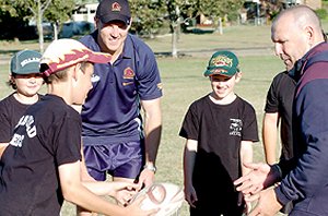 Kyle Denning, Leith Curd and Luke Stilinovich take advice from former Broncos Mick De Vere and Michael Hancock