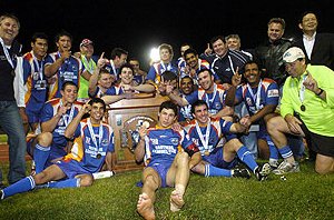 Townsville Stingers celebrate their Foley Shield victory following a 14-14 grand final defeat of the Cairns Marlins