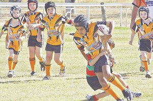 Rylan Simms makes a break for Nobbies against Mungindi in front of a home crowd on Saturday.