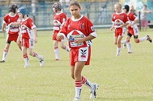 Shakira Williams on field with her Norths Devils under 11 team-mates. PHOTO : Tony Martin