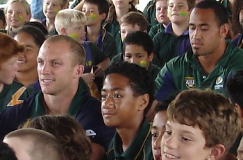 Darren Lockyer sitting with the Kruger kids