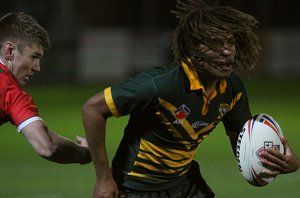 Ado Waianga runs around the Welsh defender