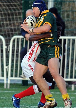 Antonio Inzitari gets tackled by an English player (Photo's : dave williams RLphotos.com)