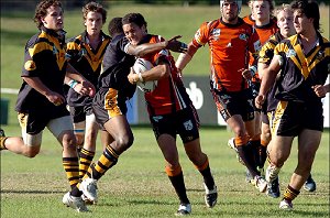 The Territory's Reece Coleman gets swarmed by Western Australia players. Picture: BRAD FLEET 