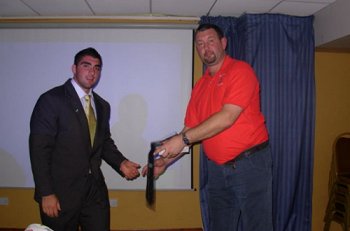 Co-Captain Tim Mannah recieves award from the Welsh Rugby League President